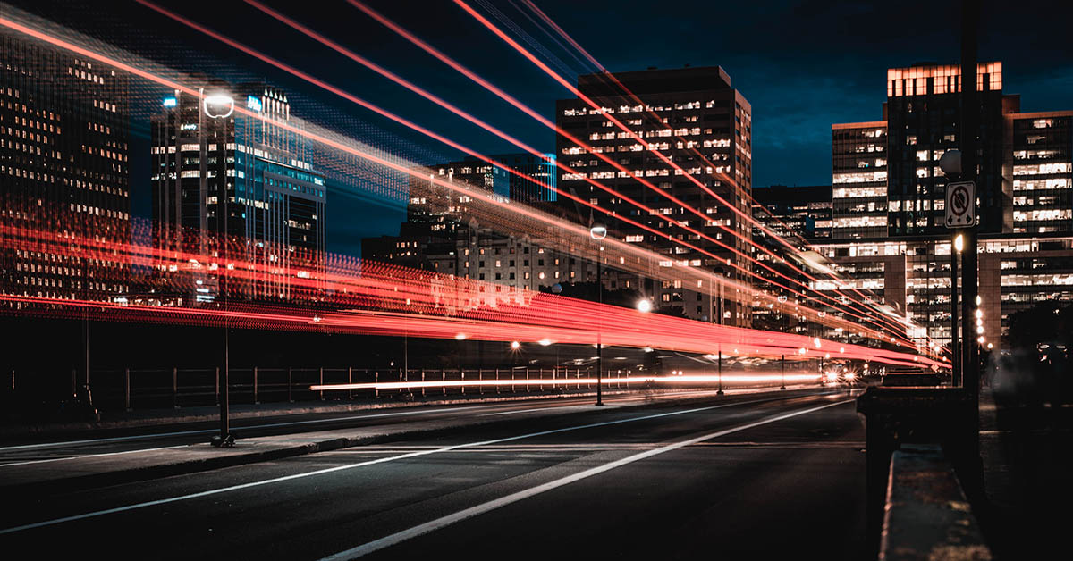 Lines of light going through dark city street