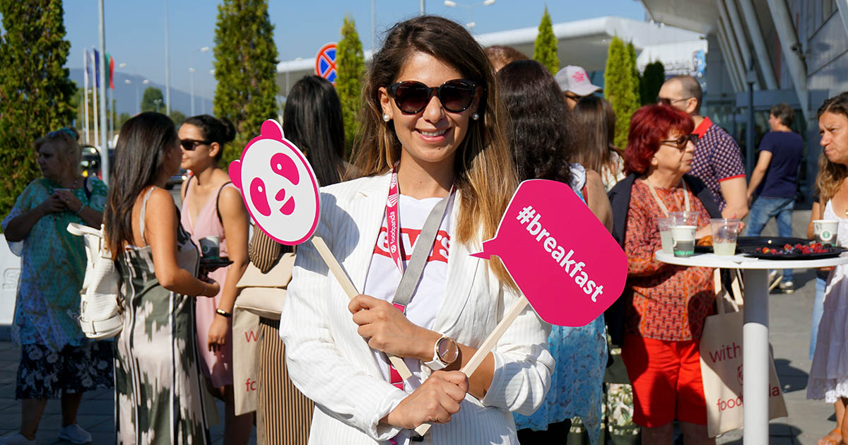 photo of milena holding panda logo and breakfast sign